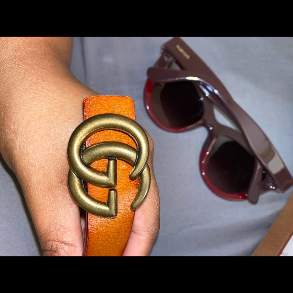 Leather belt with Double G buckle.